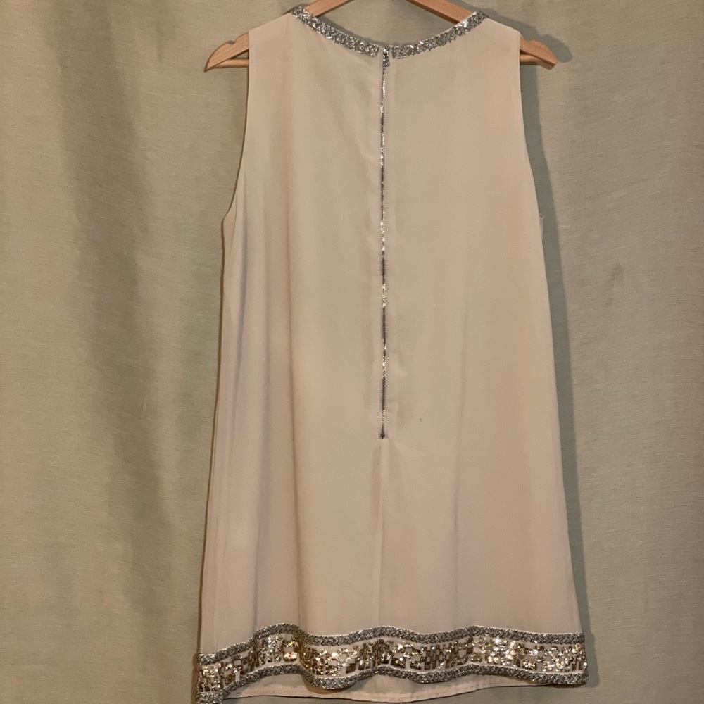 Party dress in blush champagne with beading detail trim